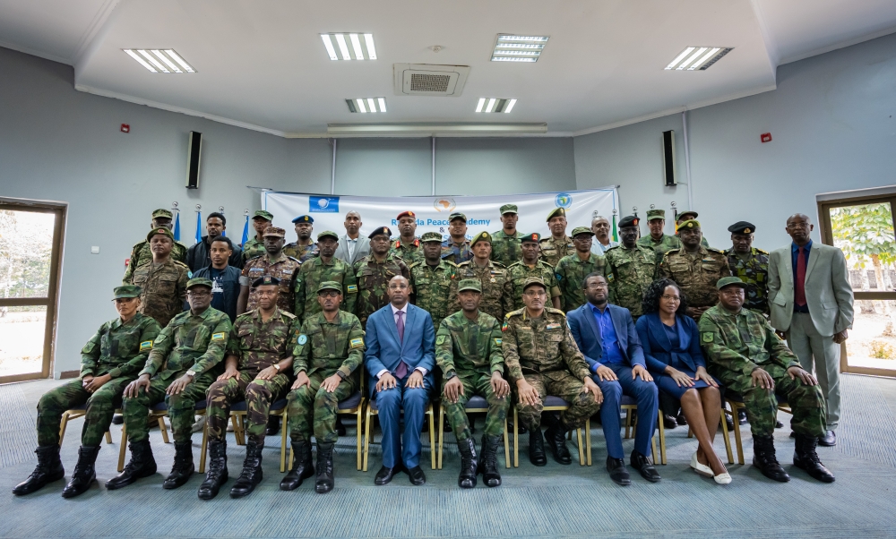 Senior officiers and officials pose for a group photo with participants