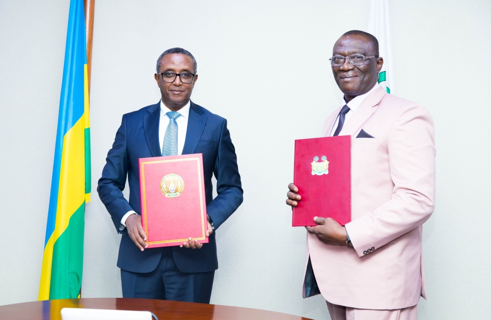 The Minister Interior Dr Vincent Biruta and  Maj Gen (Rtd) David Tamba Ocil Taluva, Minister of Internal Affairs of the Republic of Sierra Leone during the signing agreement in Kigali on Monday, August 26.Courtesy