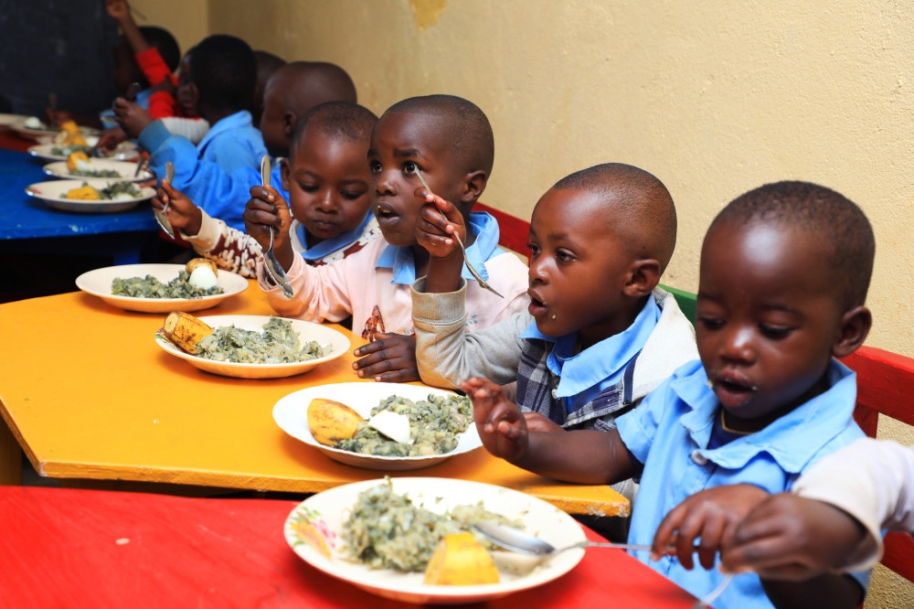 Children enjoying a nutritious meal at an Early Childhood Development Centre (ECD) in Nyamasheke District, thanks to the “Gikuriro Kuri Bose” programme that aims to combat stunting. Photo: Craish Bahizi.