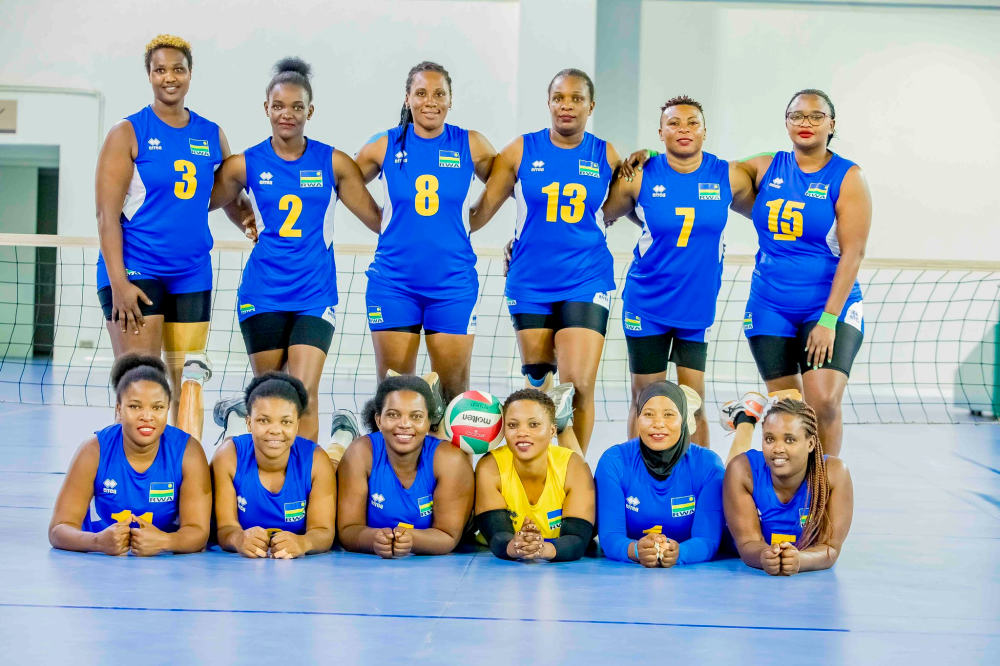 Rwanda sitting volleyball team players pose for a photo.