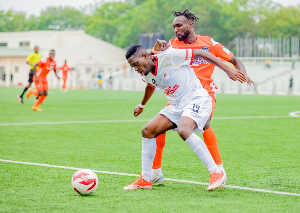 Musanze FC and AS Kigali players battle for the ball during their 0-1 game in Kigali. Courtesy