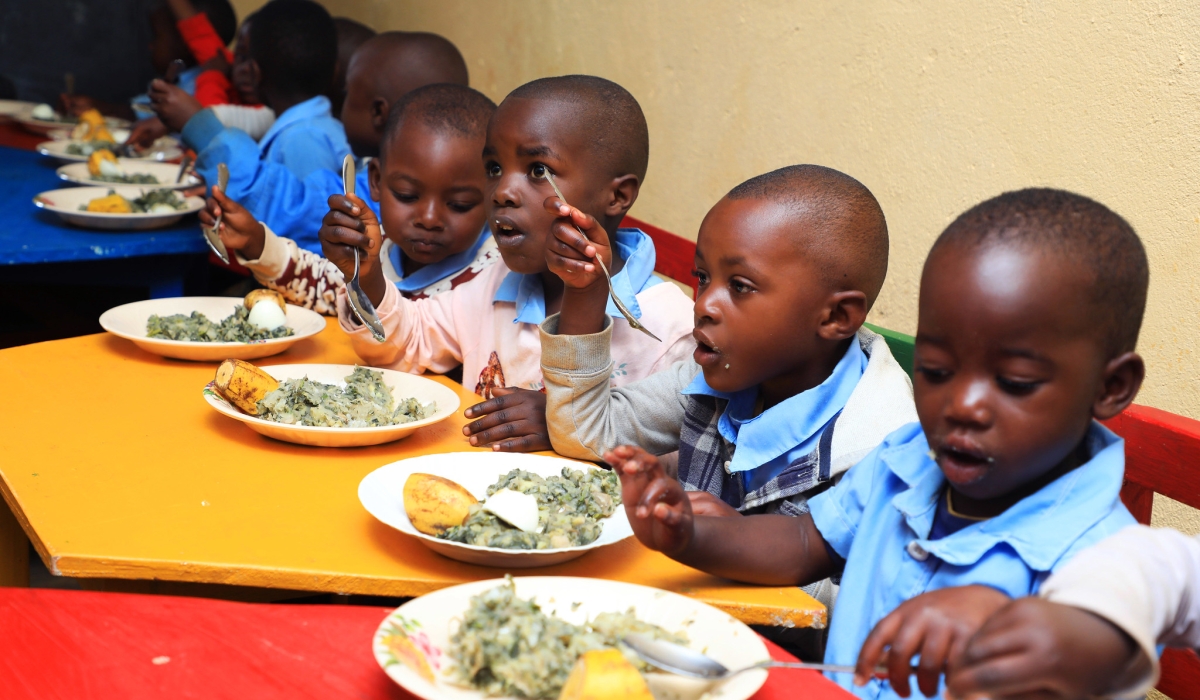 Children enjoying a nutritious meal at an Early Childhood Development Centre (ECD) in Nyamasheke District, thanks to the “Gikuriro Kuri Bose” programme that aims to combat stunting. Photo: Craish Bahizi.