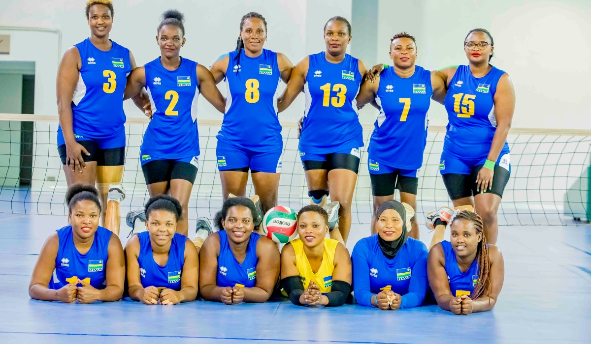 Rwanda sitting volleyball team players pose for a photo.