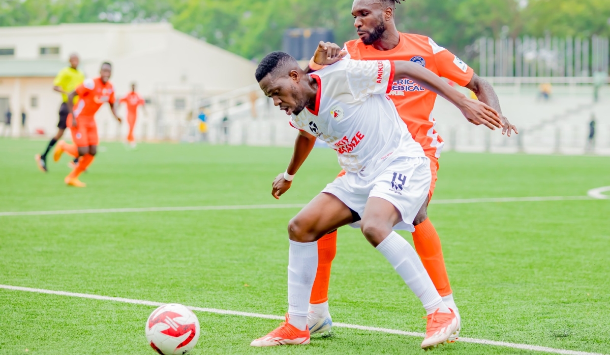 Musanze FC and AS Kigali players battle for the ball during their 0-1 game in Kigali. Courtesy