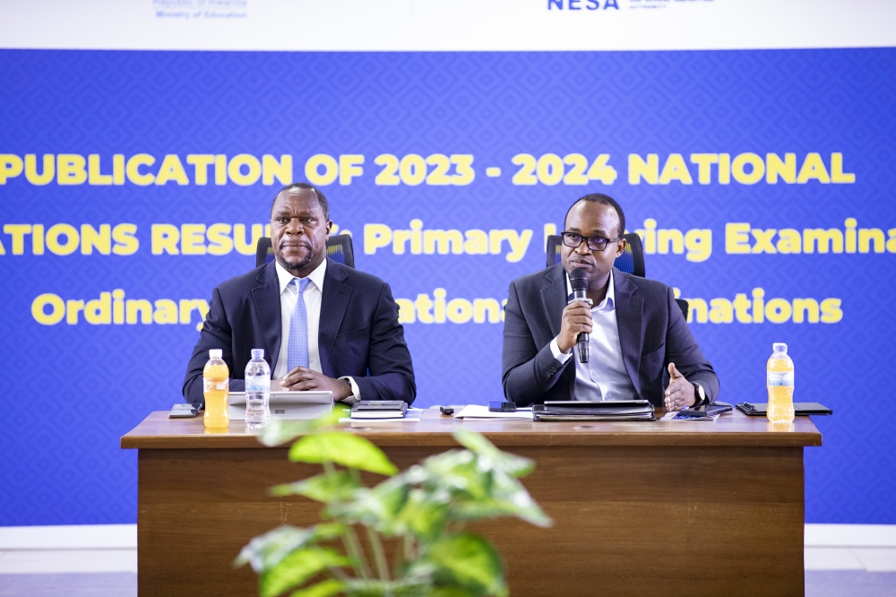 Minister of Education Gaspard Twagirayezu (R) speaks during the release of national examinantion results on Tuesday as the Director General of NESA, Bernard Bahati looks on.