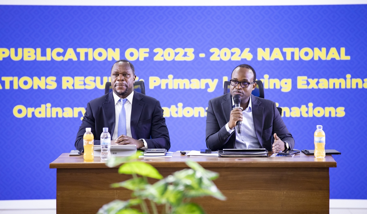 Minister of Education Gaspard Twagirayezu (R) speaks during the release of national examinantion results on Tuesday as the Director General of NESA, Bernard Bahati looks on.