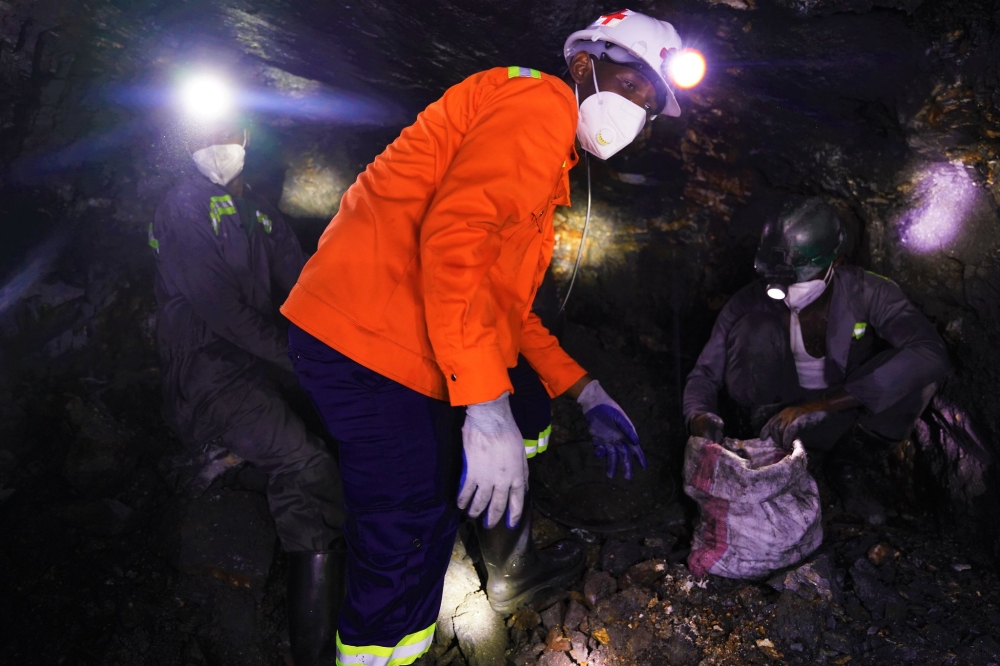 Miners collect minerals inside a tunnel at Rulindo based mining site on March 9, 2022. Photo by Craish bahizi