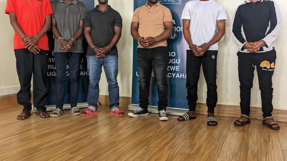 The Rwanda Investigation Bureau paraded six individuals accused of conspiracy to commit fraud, hacking into computer networks, and robbery. Photo by Shallon Mwiza