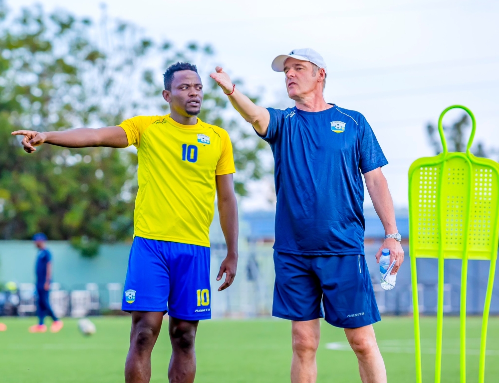 National football team (Amavubi) head coach Frank Spittler Torsten gives instructions to Muhadjili Hakizimana during a training session at Kigali Pele Stadium. File