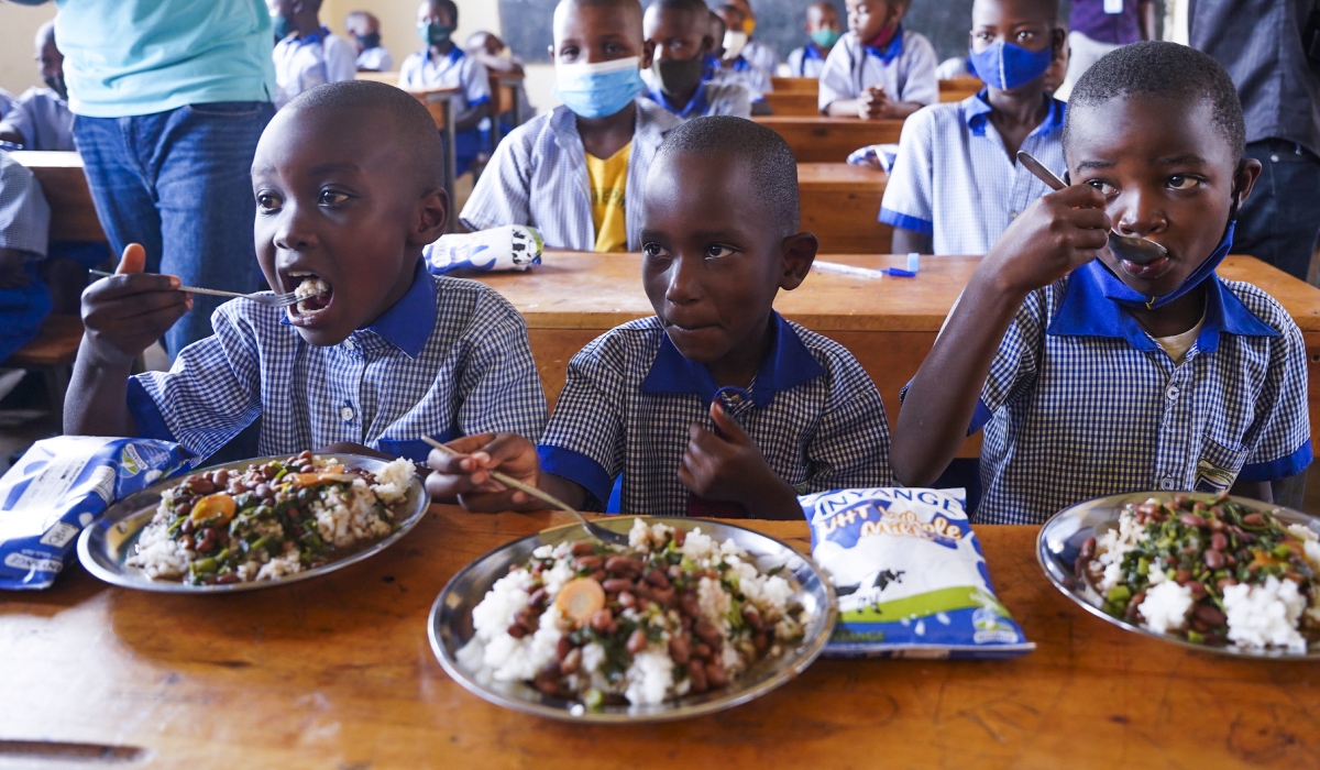 Students have  meal through schoolfeeding programme  at Groupe Scolaire Ayabaraya in Kicukiro district   on Monday, February 28. Photo by Craish Bahizi