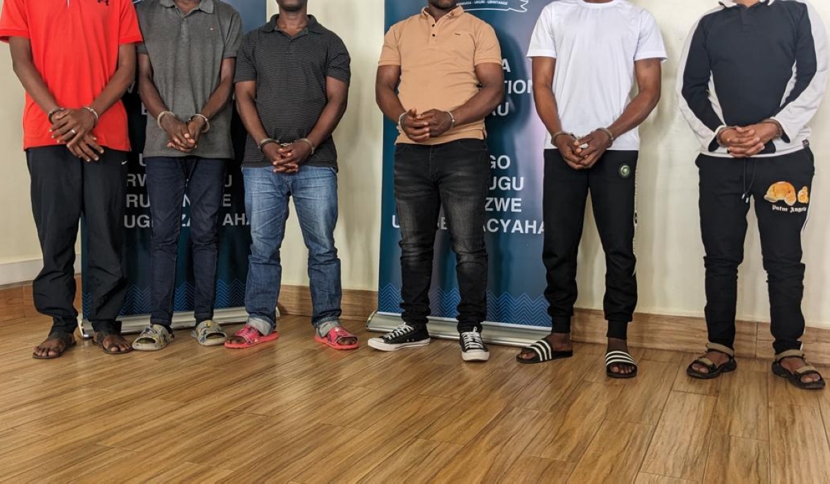 The Rwanda Investigation Bureau paraded six individuals accused of conspiracy to commit fraud, hacking into computer networks, and robbery. Photo by Shallon Mwiza