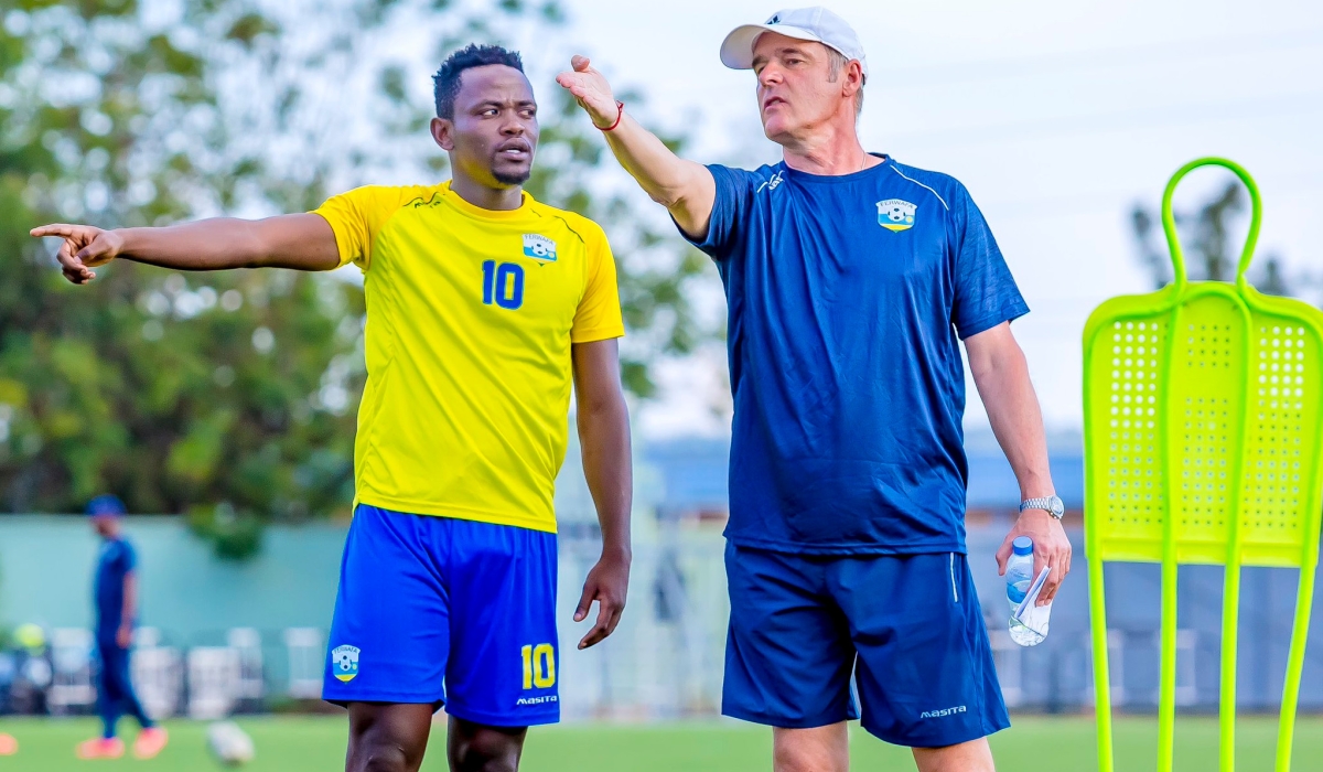 National football team (Amavubi) head coach Frank Spittler Torsten gives instructions to Muhadjili Hakizimana during a training session at Kigali Pele Stadium. File