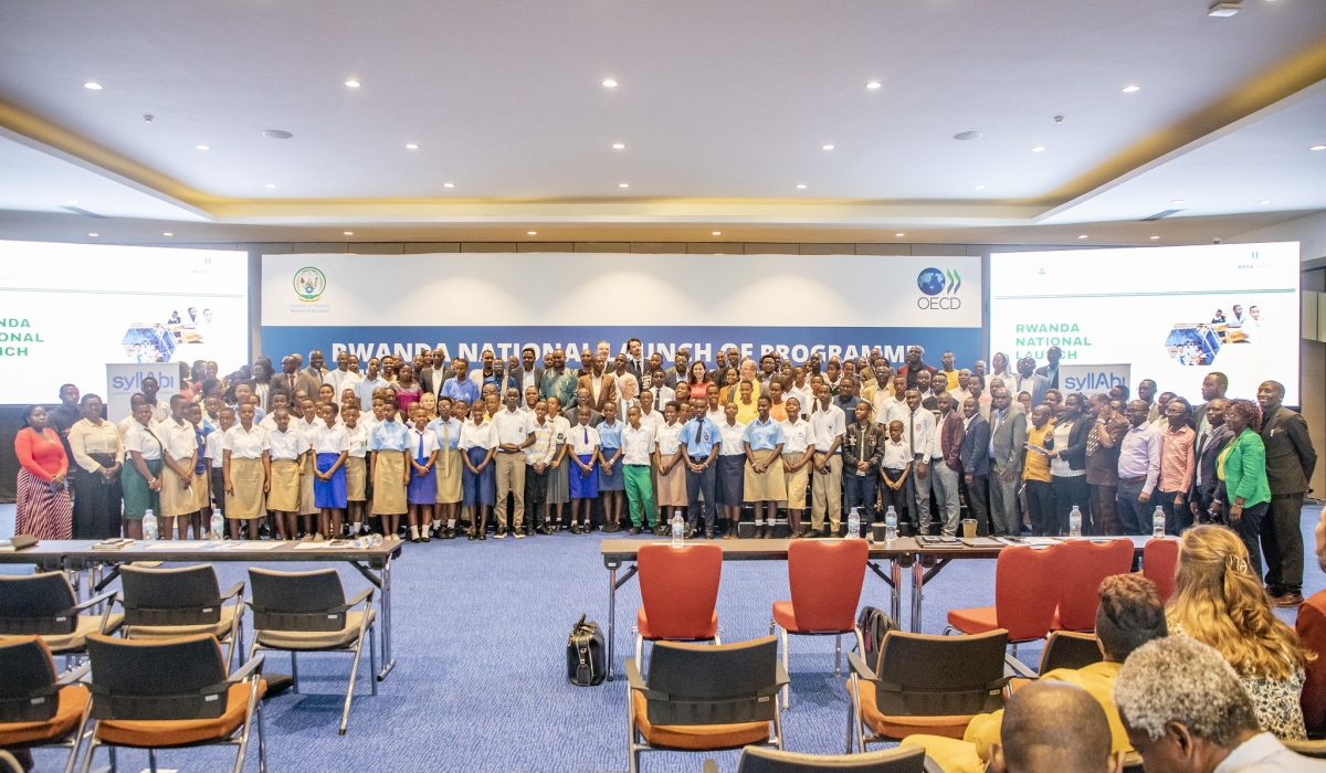 Officials and students pose for a group photo after the launch of Rwanda&#039;s participation in the Programme for International Student Assessment in Kigali, on Friday, August 30. Photos by Emmanuel Dushimimana.