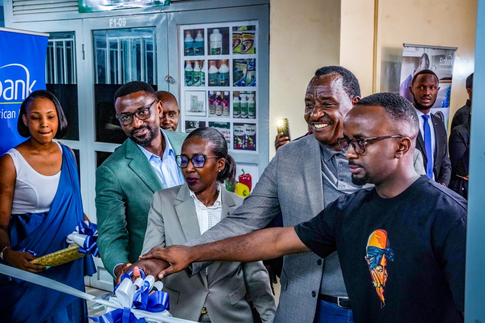 Ecobank Managing Director Caline Umutoni (c) and clients during the opening of a new branch in Nyabugogo on Thursday, August 29. All photos by Craish Bahizi