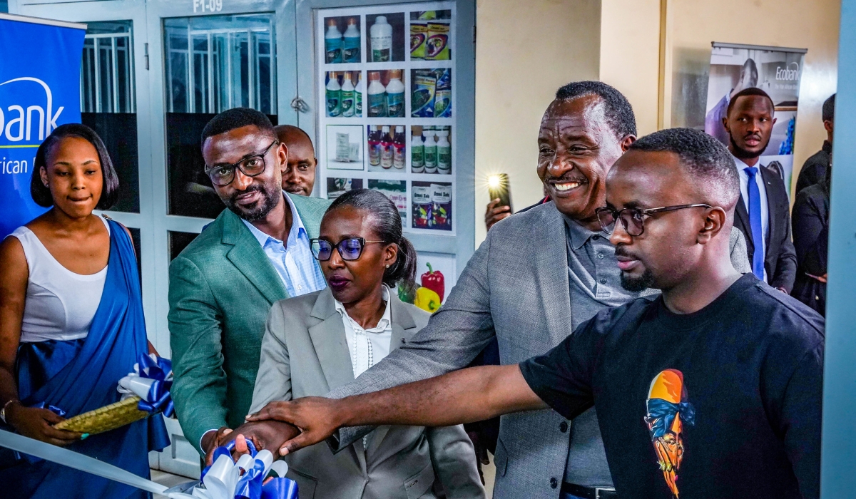 Ecobank Managing Director Caline Umutoni (c) and clients during the opening of a new branch in Nyabugogo on Thursday, August 29. All photos by Craish Bahizi