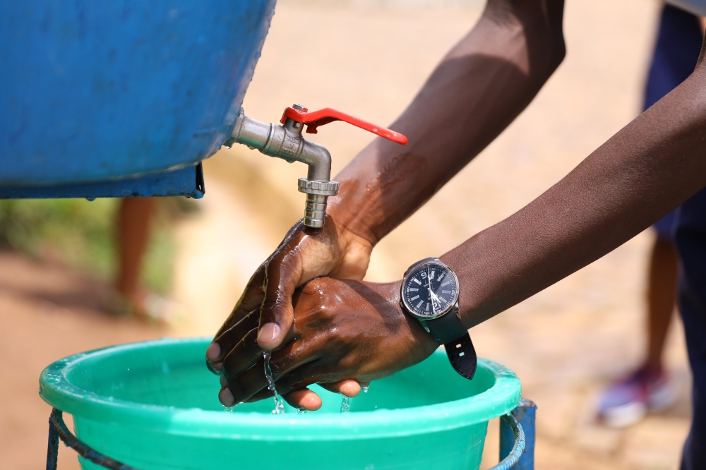 A student washes hands at Groupe Scolaire Rugando in Kimihurura Sector Gasabo District. Sam Ngendahimana