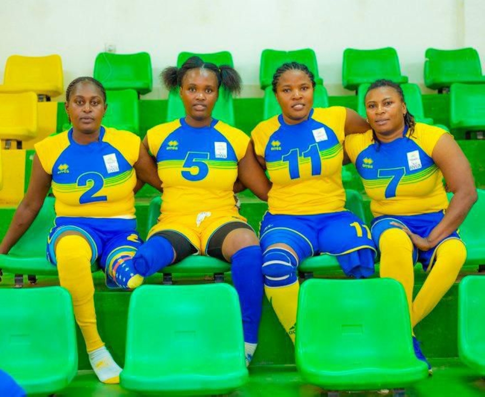 Rwandan female volleyball player Claudine Bazubagira (R) and her teammates.