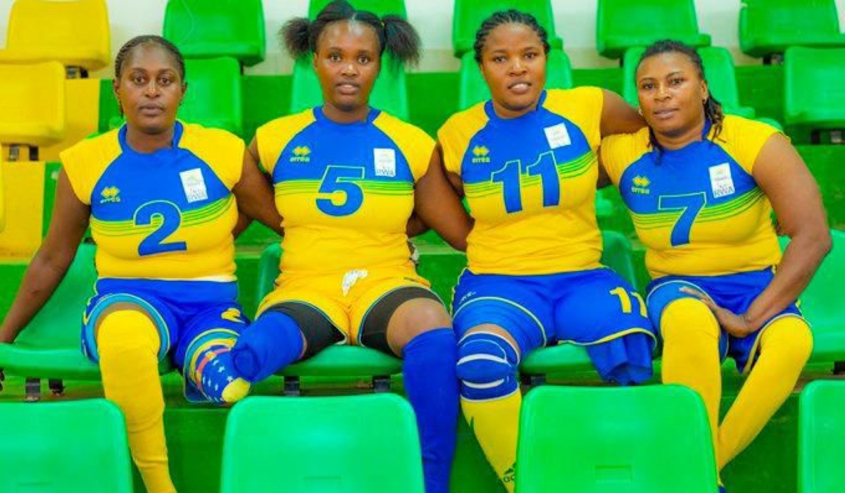 Rwandan female volleyball player Claudine Bazubagira (R) and her teammates.