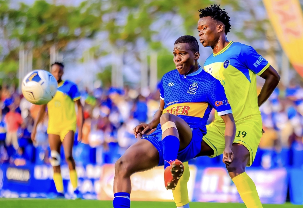 Rayon Sports midfielder Adama Bagayogo controls the ball against Amagaju FC defender at Kigali Stadium. Courtesy