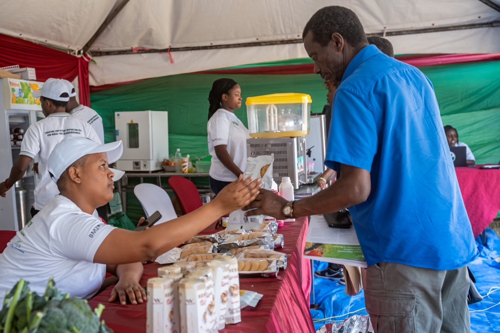 An exhibitor showcases her products during Agri show at Mulindi. Photo by Dan Gatsinzi