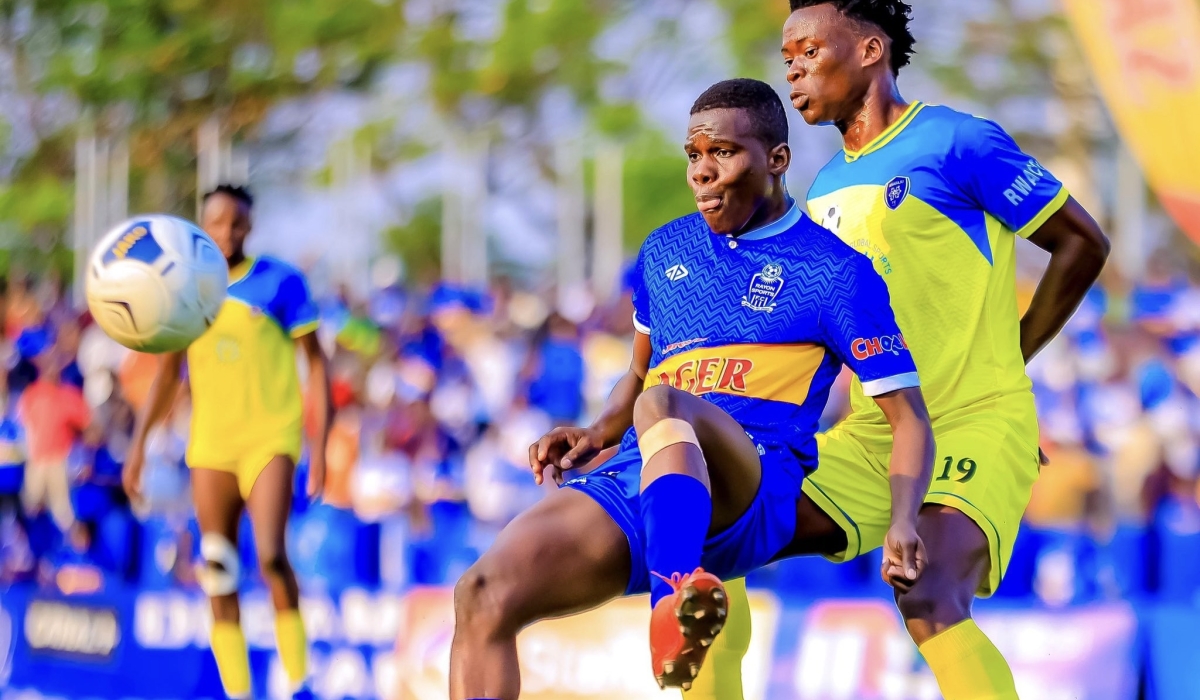 Rayon Sports midfielder Adama Bagayogo controls the ball against Amagaju FC defender at Kigali Stadium. Courtesy