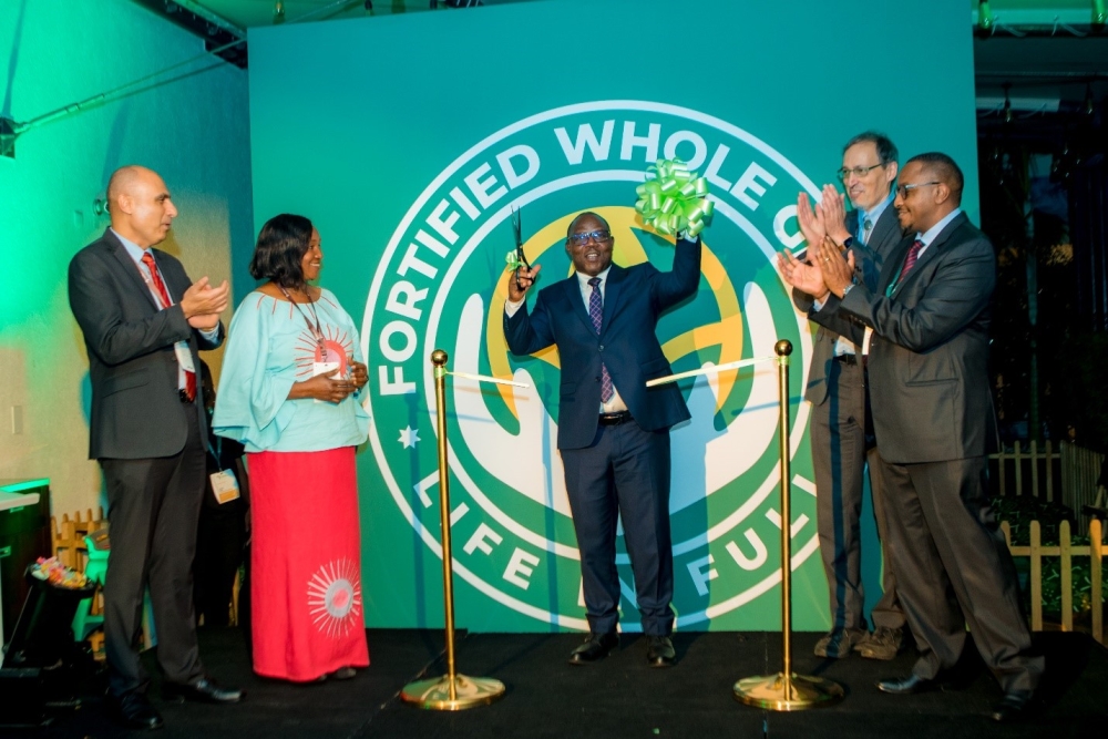 Rwanda&#039;s Minister of Local Government, Jean Claude Musabyimana, officially launches the Fortified Whole Grain Alliance (FWGA) in Kigali, on Tuesday, September 3. With him are David Kamau (FWGA), Roy Steiner, Peiman Milani, and Betty Kibaara of the Rockefeller Foundation. Courtesy photo