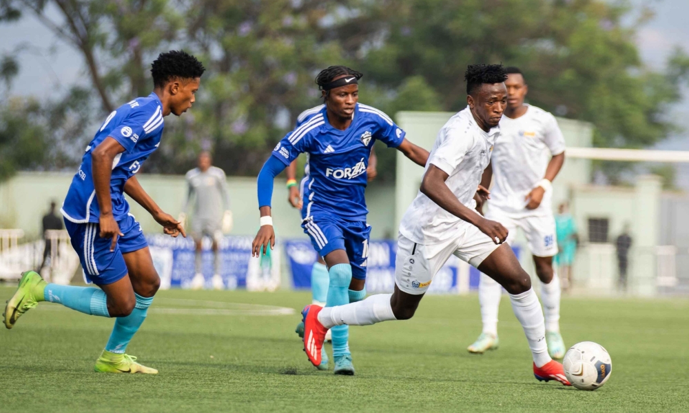 Rayon Sports&#039; Burundian  forward Abdul Rahman Rukundo wins the ball against Gorilla FC players at Kigali Pele Stadium. Craish BAHIZI