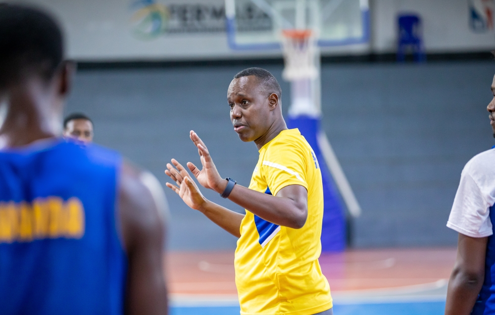 Rwanda U18 head coach Murenzi gives instructions to the players during a training session in Kigali. Courtesy