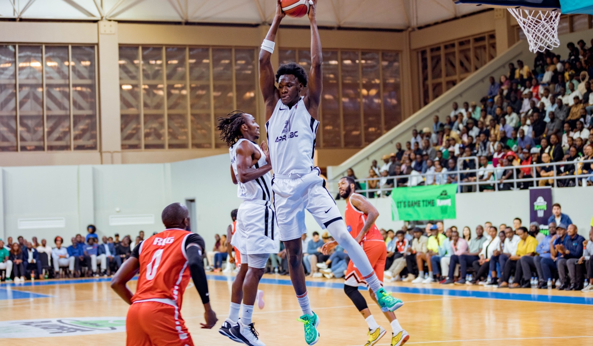 Star center Aliou Diarra jumps high to claim the ball during APR&#039;s 66-61 victory over REG on Wednesday night. APR advanced to the finals after winning the series 3-0-Photos by Dan Gatsinzi