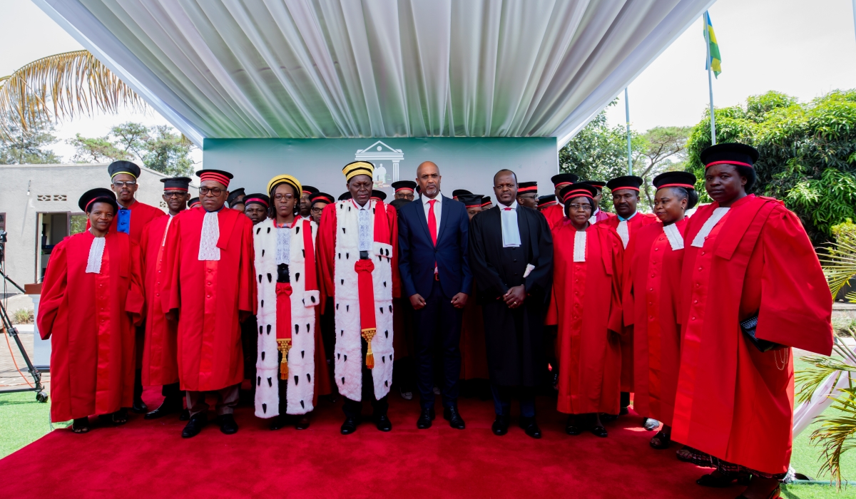 Chief Justice Faustin Ntezilyayo and Minister of Justice Emmanuel Ugirashebuja pose for a photo with judges during the launch of judicial year on Monday. Courtesy