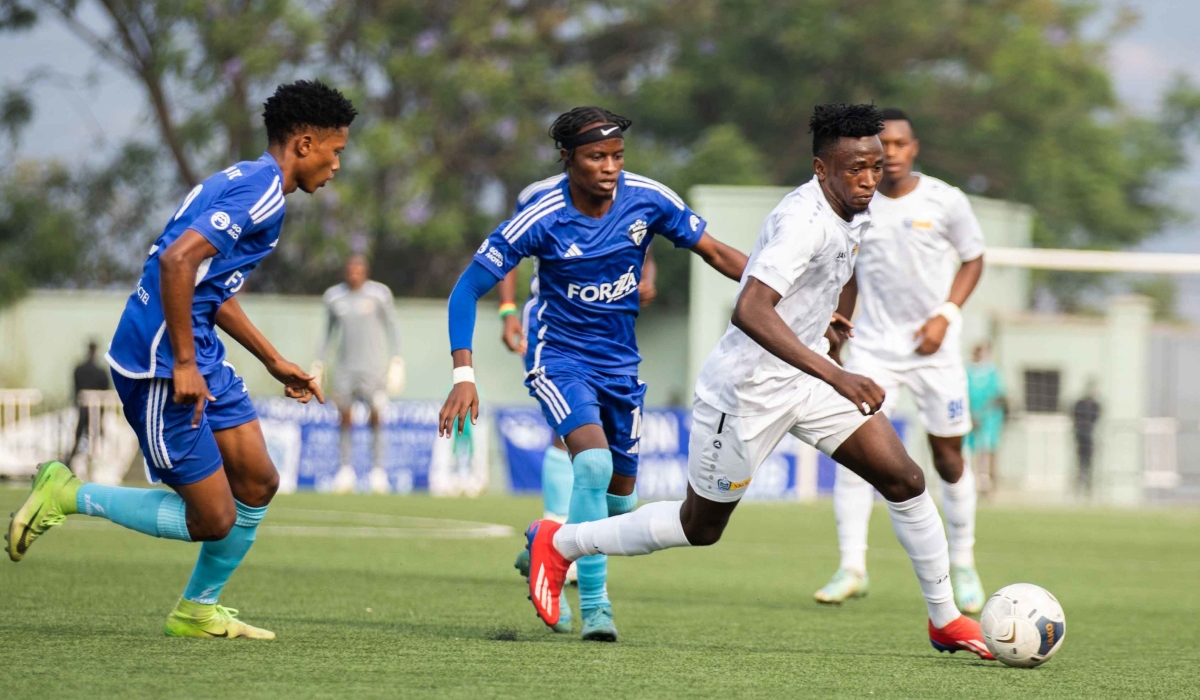 Rayon Sports&#039; Burundian  forward Abdul Rahman Rukundo wins the ball against Gorilla FC players at Kigali Pele Stadium. Craish BAHIZI