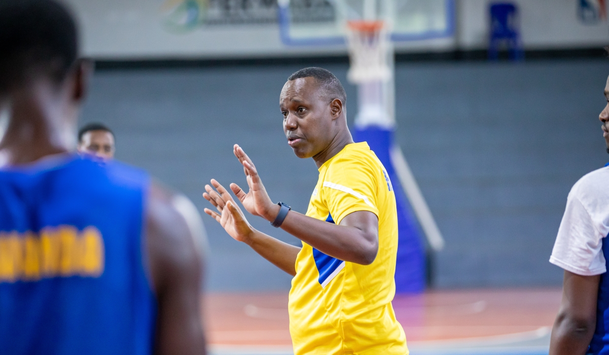 Rwanda U18 head coach Murenzi gives instructions to the players during a training session in Kigali. Courtesy