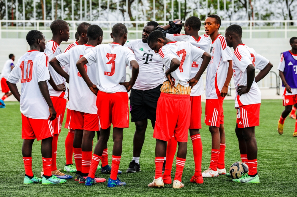 Ten young footballers selected to represent Rwanda at the FC Bayern Youth Cup pose with officials at Pele Stadium on Thursday, September 5 Craish Bahizi 