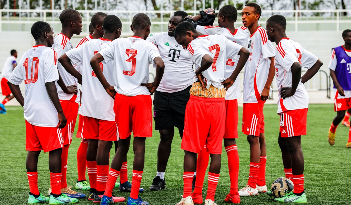 Ten young footballers selected to represent Rwanda at the FC Bayern Youth Cup pose with officials at Pele Stadium on Thursday, September 5 Craish Bahizi 