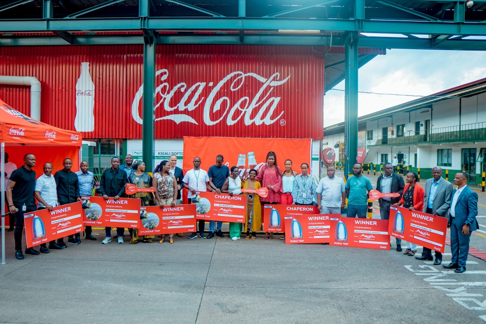 Officials pose for a group photo with top performers of the  challenge dubbed ‘Dubai Twagiye’ which ran from February to June 2024. Courtesy