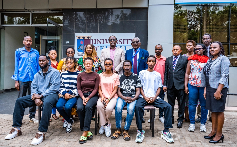 Prof Manasseh Nshuti, Chairman of the Board of Promoters and other officials pose for a photo with parents and students after a meeting on Friday, September 6. All photos by Craish Bahizi