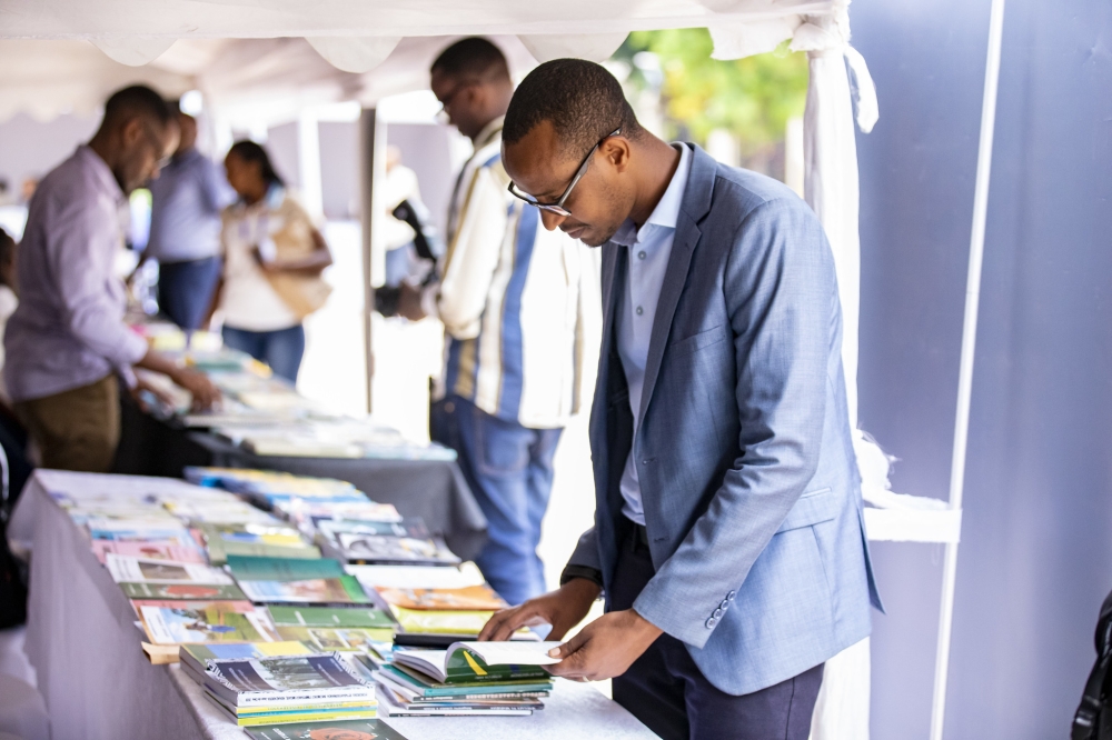 People reviewing books during a mini-exhibition in Kigali on Friday, September 6. All photos by Emmanuel Dushimimana