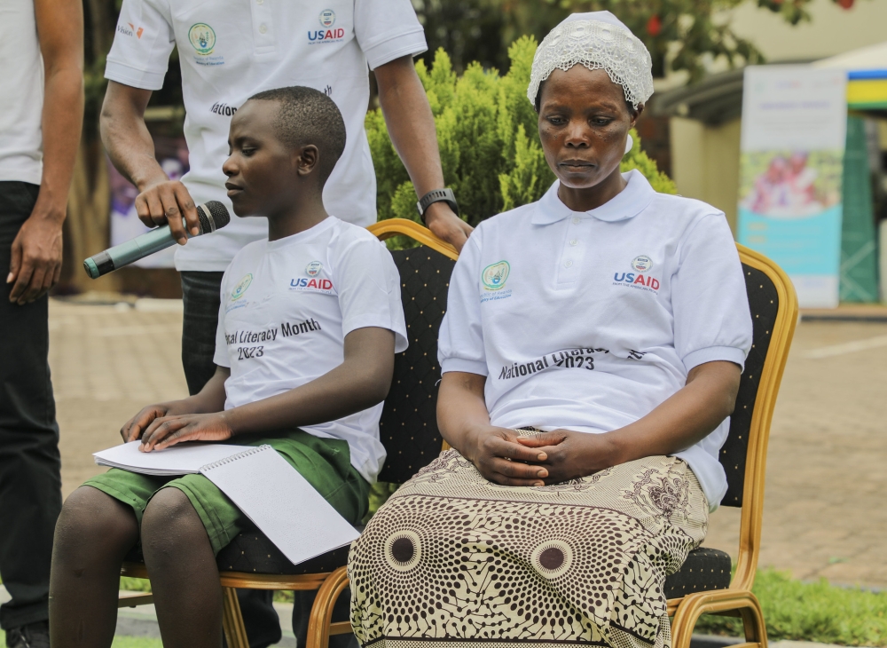 A child with disablity reading a school textbook in Braille format at the event. REB initiated a project to translate all school textbooks into Braille format.