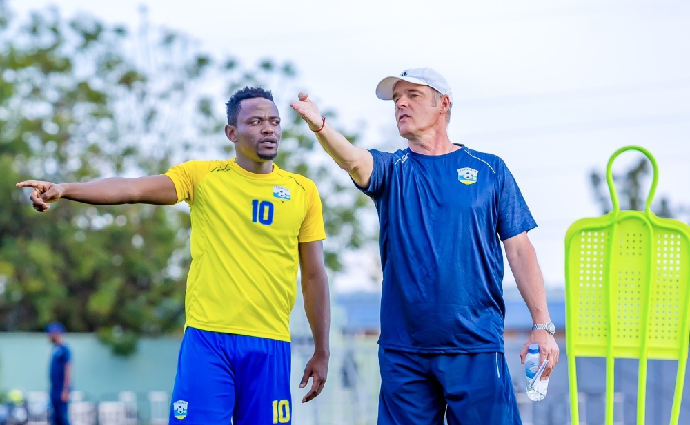 National football team (Amavubi) head coach Frank Spittler Torsten gives instructions to Muhadjili Hakizimana during a training session at Kigali Pele Stadium. File