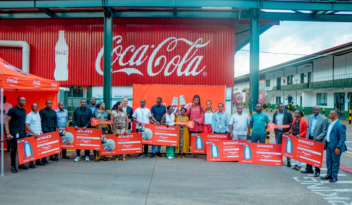 Officials pose for a group photo with top performers of the  challenge dubbed ‘Dubai Twagiye’ which ran from February to June 2024. Courtesy