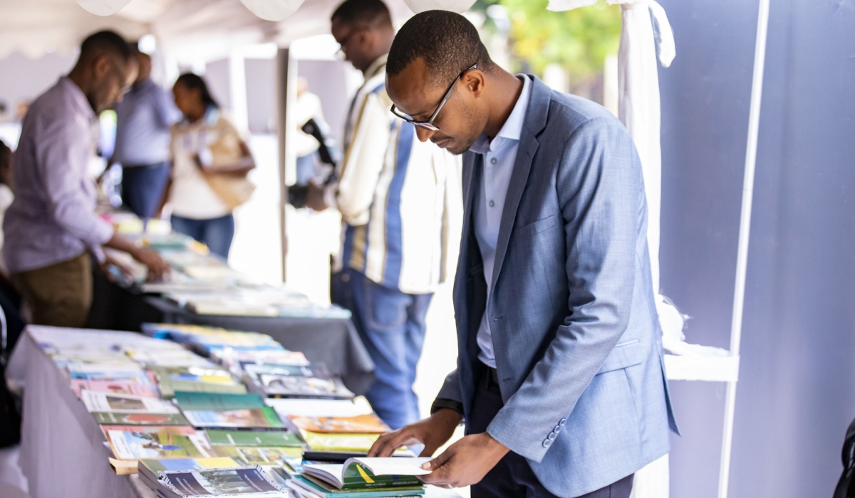 People reviewing books during a mini-exhibition in Kigali on Friday, September 6. All photos by Emmanuel Dushimimana