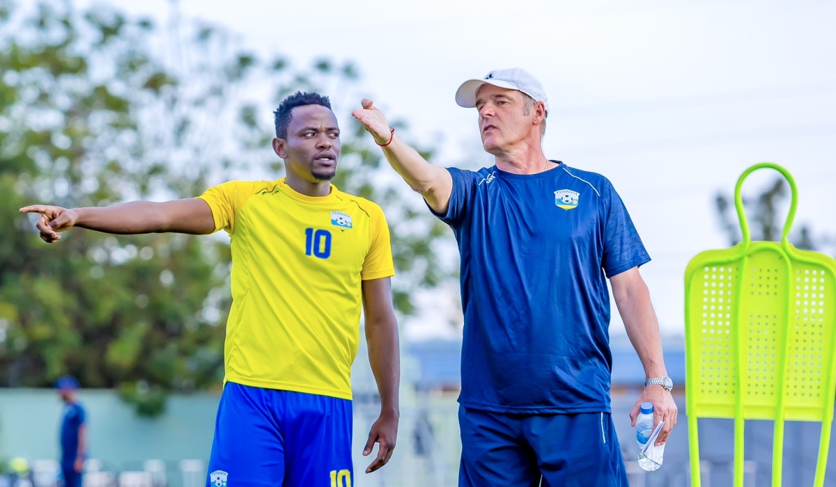 National football team (Amavubi) head coach Frank Spittler Torsten gives instructions to Muhadjili Hakizimana during a training session at Kigali Pele Stadium. File