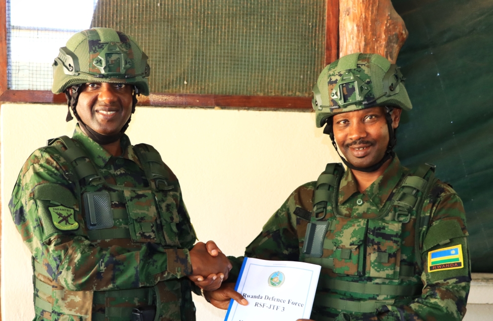 Maj Gen Emmy Ruvusha and Maj Gen Alex Kagame during the handover event as he takes over as the new commander of the Rwanda Security Force (RSF) Joint Task Force in Mozambique’s Cabo Delgado Province on September 7. Courtesy