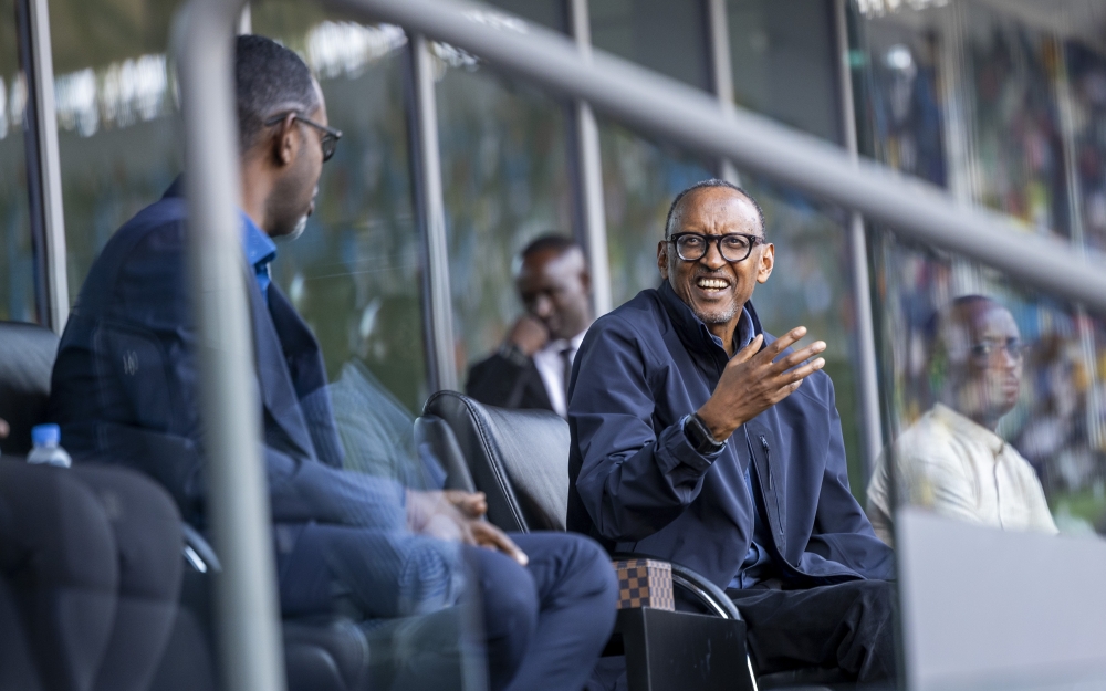 President Paul Kagame interacts with Richard Nyirishema, Minister of Sports as He  attends  Tuesday’s Africa Cup of Nations FCON qualifier between Rwanda and Nigeria at Amahoro Stadium on Tuesday, September 10. All photos by Olivier Mugwiza