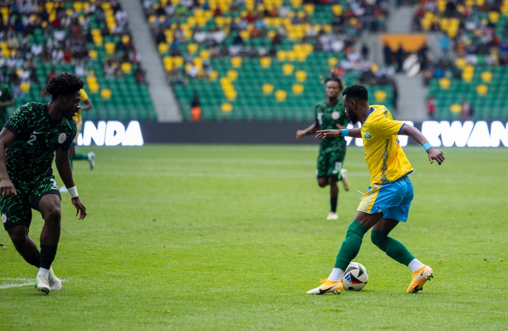 Winger Gilbeet tries to dribble past Nigeria&#039;s Ola Aina during during Tuesday afternoon&#039;s goalless draw at Amahoro Stadium-Photo by Olivier Mugwiza.