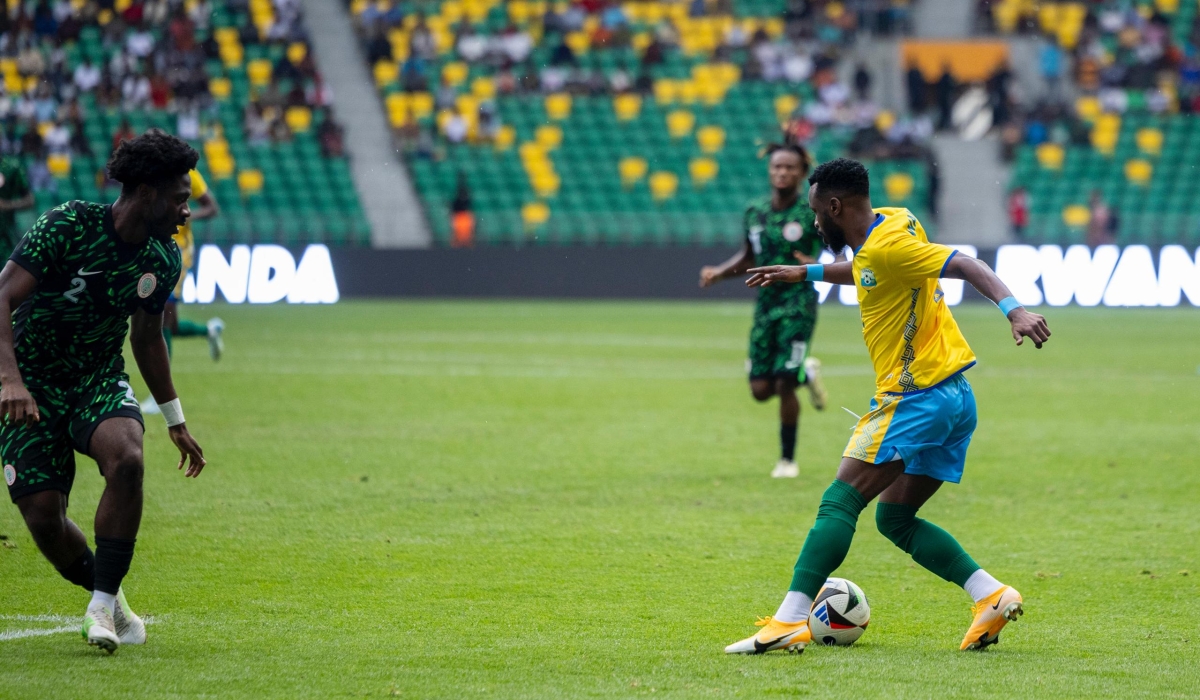 Winger Gilbeet tries to dribble past Nigeria&#039;s Ola Aina during during Tuesday afternoon&#039;s goalless draw at Amahoro Stadium-Photo by Olivier Mugwiza.