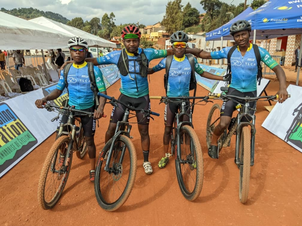 Florent Nsengumuremyi(2nd L), the founder of Twin Lakes Cycling Academy and the academy&#039;s young cyclists during a past youth race competition-courtesy