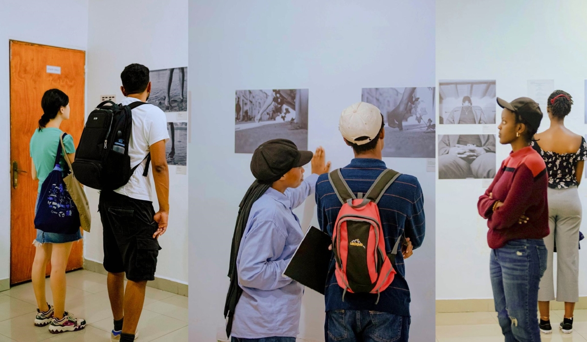 Visitors go through different visuals showcased at Le Mal du Corps exhibition in Kigali. Courtesy