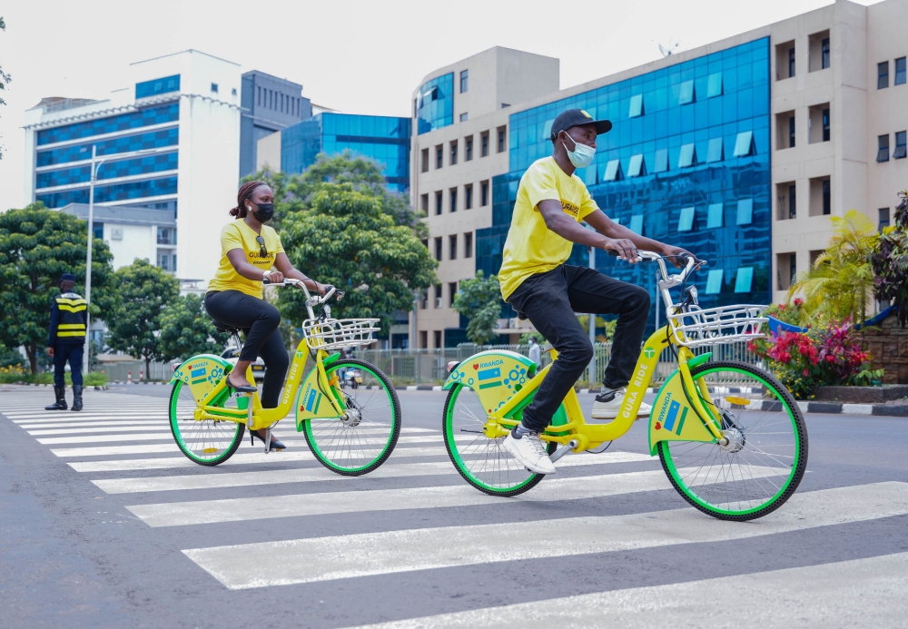 Residents ride GURARIDE bicycles near City of Kigali head offices in 2022. Guraride, a local start-up that owns Guraride project in Kigali. Photos by Craish Bahizi