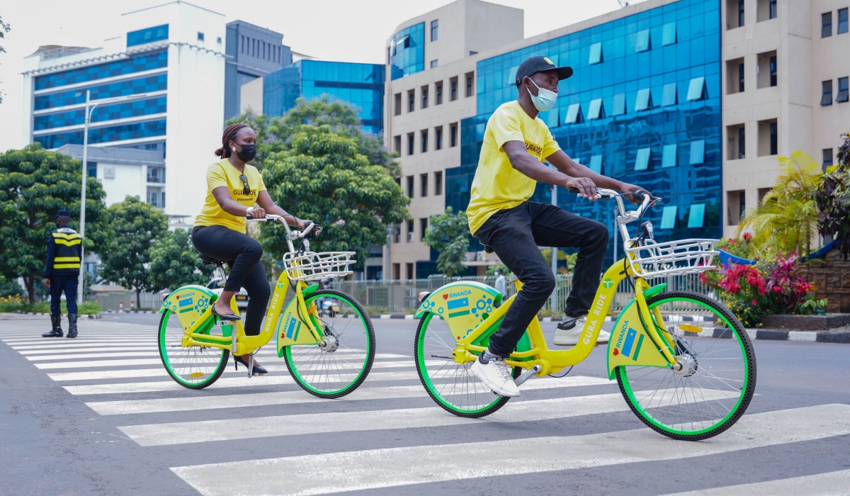 Residents ride GURARIDE bicycles near City of Kigali head offices in 2022. Guraride, a local start-up that owns Guraride project in Kigali. Photos by Craish Bahizi